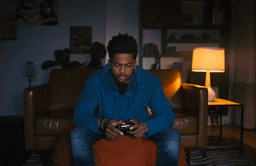 Looping video of someone utilizing Google Assistant via their TV 